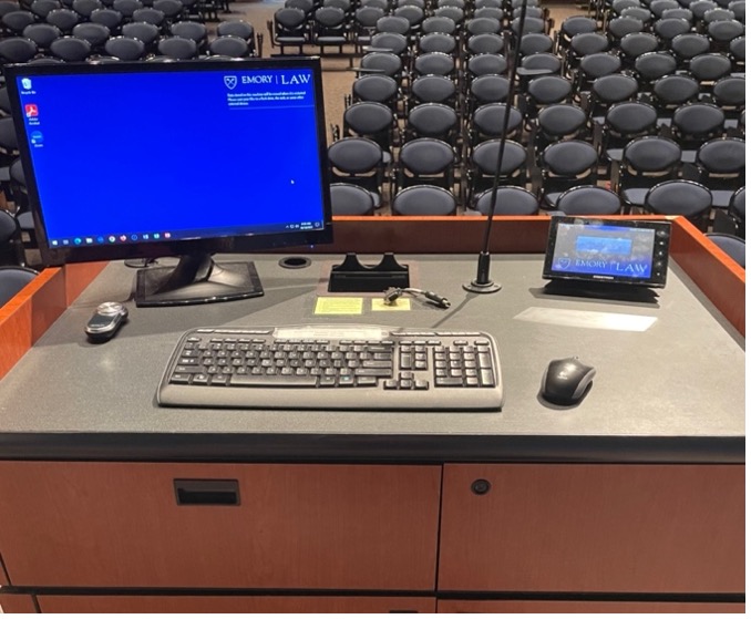 Computer and keyboard and touchscreen panel on podium