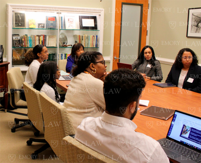 Professor Pinder sits with her class of Emory Law students