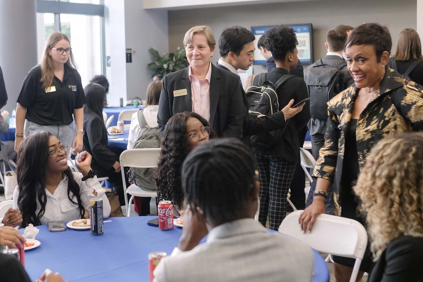Judge Glenda Hatchett and Dean Mary Anne Bobinski mingling with Emory Law 1Ls at the Professionalism Day reception