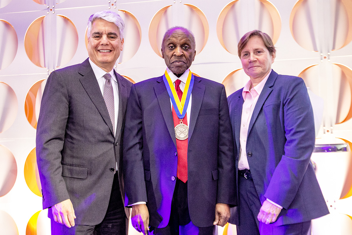 Cooper 67L, center, with Emory University President Fenves, left, and Emory Law Dean Bobinski, right